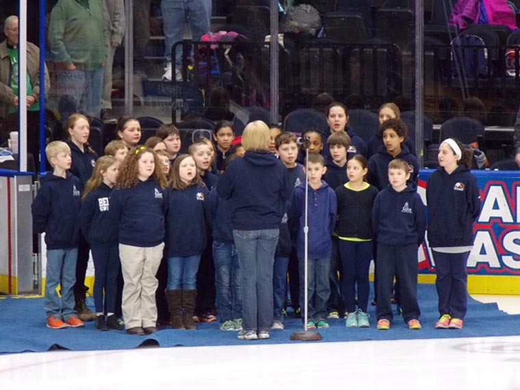 Students sing National Anthem