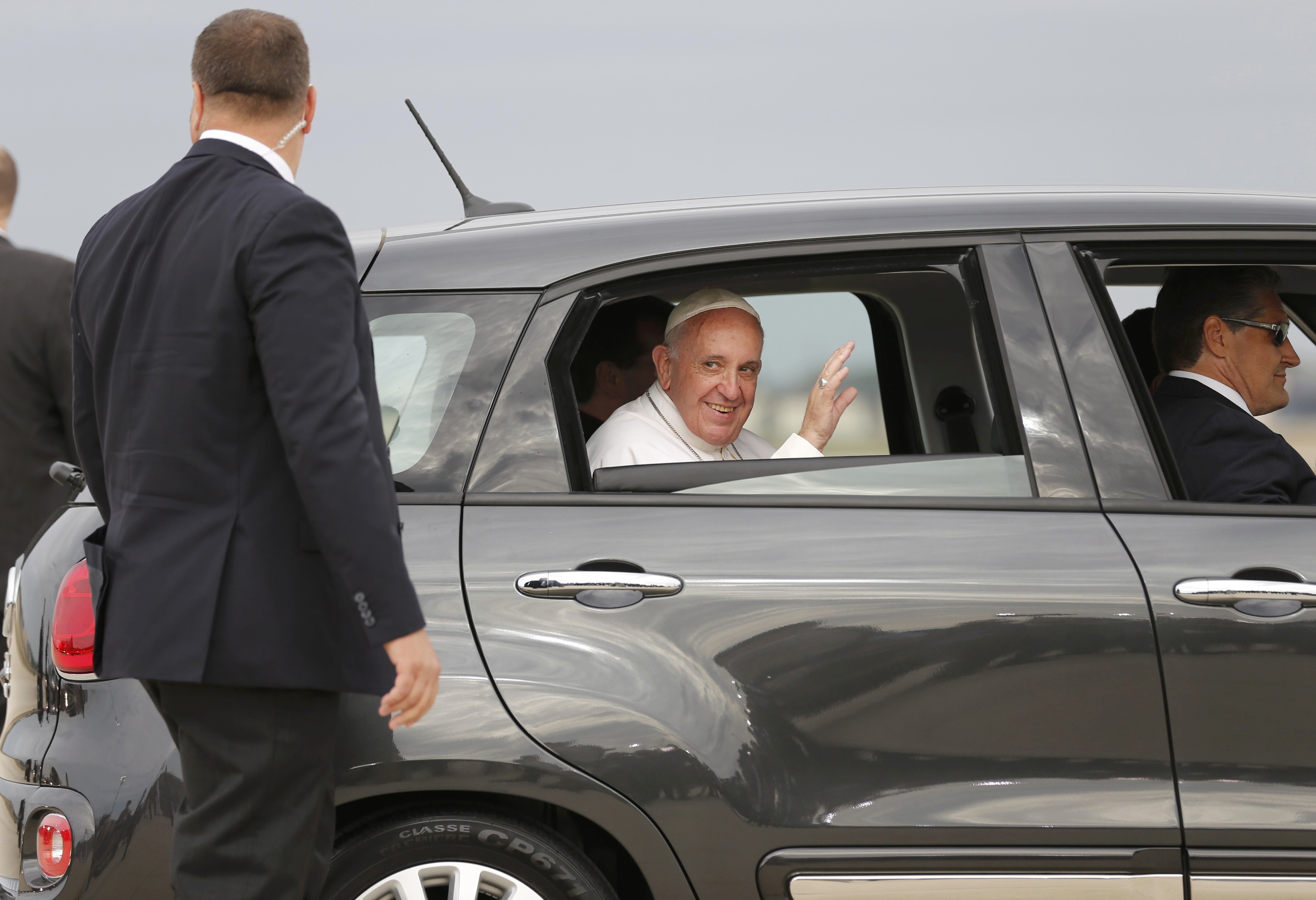 Pope Francis rides away in Fiat after arriving to United States at Joint Base Andrews
