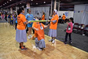 A playful moment at the Youth Congress with IHM sisters. (Sun photo | Katherine Long)