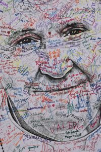 Pope art on the streets of Philadelphia, created by a local artist and continuing to evolved with every signature. (Sun photo | Katherine Long)