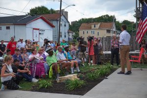 A Tiny Home for Good, Inc. Executive Director Andrew Lunetta speaks to those assembled for the ribbon-cutting ceremony July 22. (Sun photo | Chuck Wainwright)