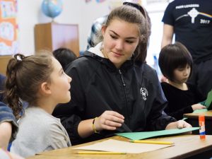 In the foreground, Jayleana Bowman and Emily Monroe work on their door tag. (Sun photo | Chuck Wainwright)