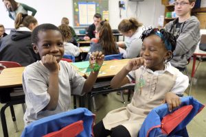 Kwame Winwah and Asimwe Kabulete show off their finished pieces. (Sun photo | Chuck Wainwright)