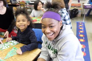 Saharra Jennings and Ajahnik Brown at work on their door tag. (Sun photo | Chuck Wainwright)