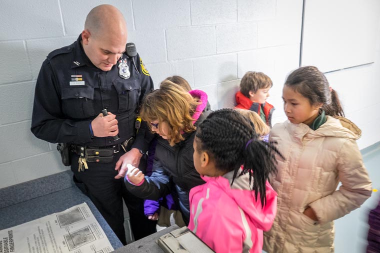 St. James students deliver gifts to police on Day of Service