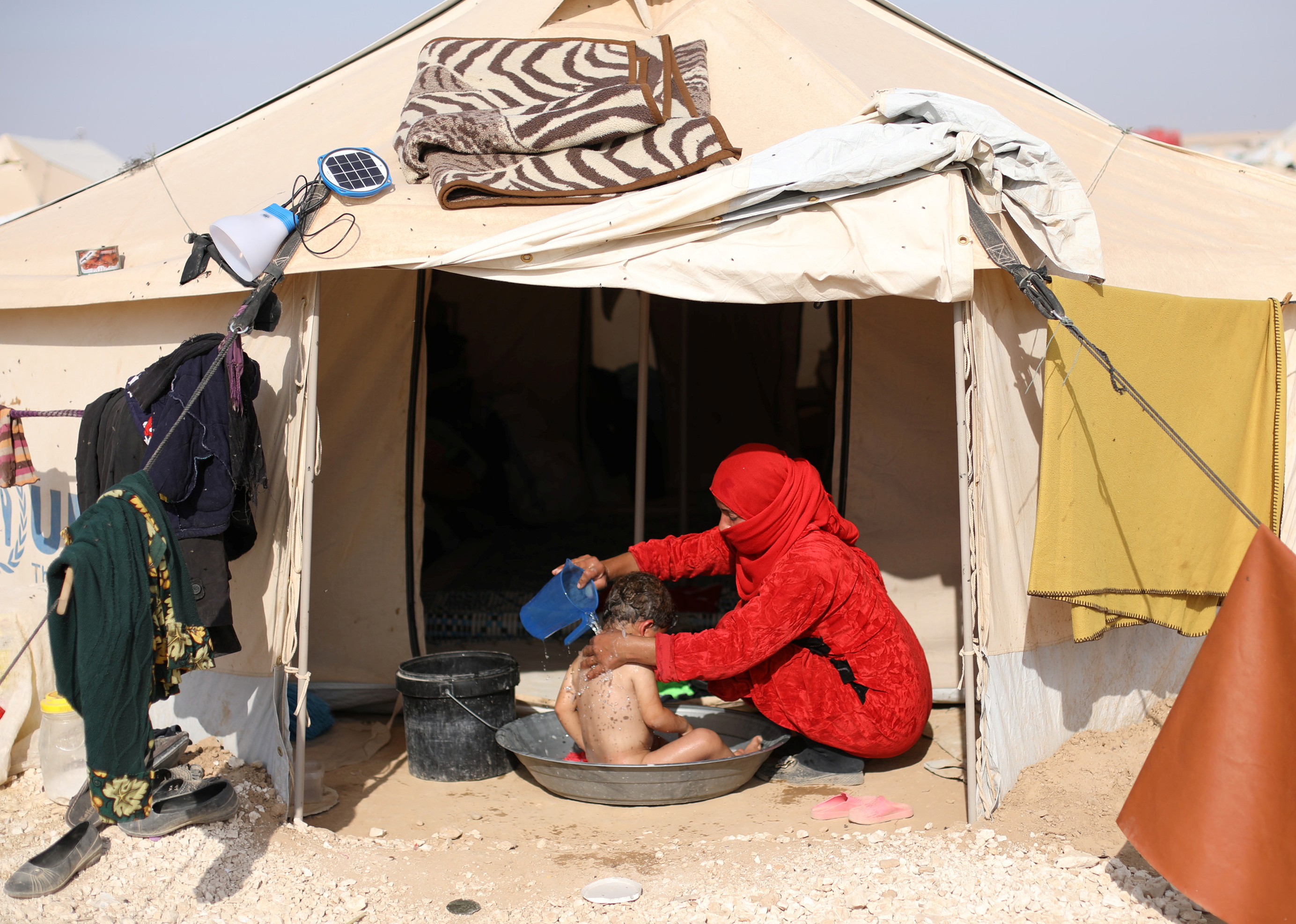 DISPLACED WOMAN SYRIA CAMP