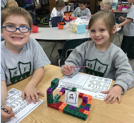 Holy Family students work on Halloween STREAM project
