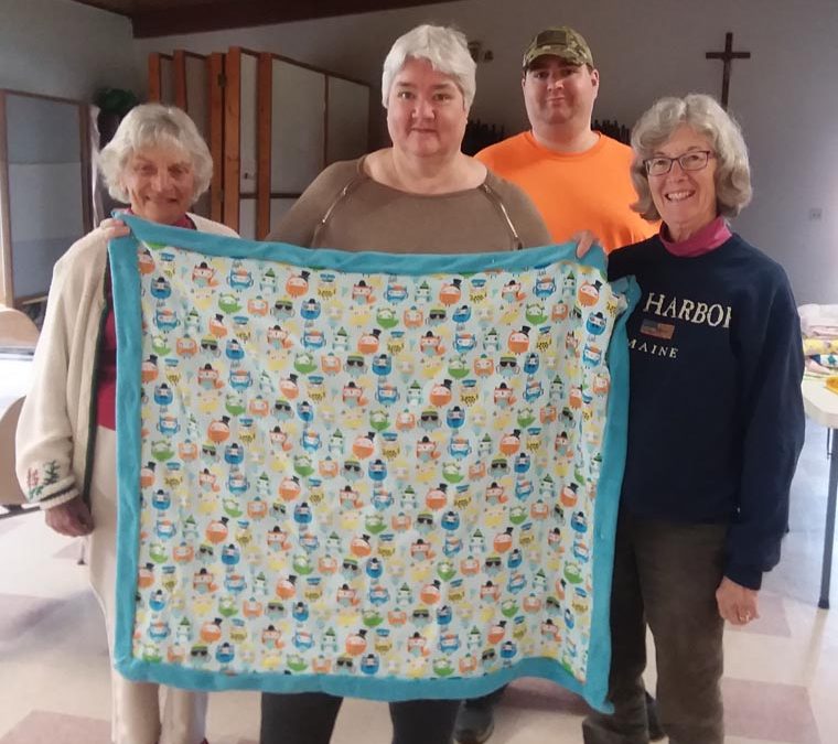 Tully parishioners make quilts for those in need