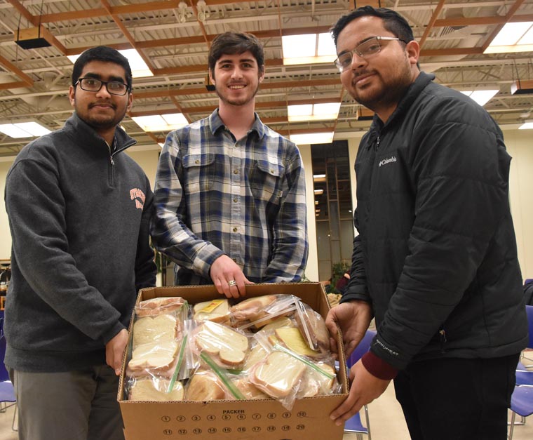 Scholars pause for charity, interfaith solidarity