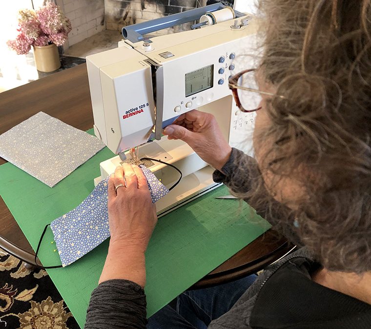 Face masks of fury: churning them out in Town of Maine