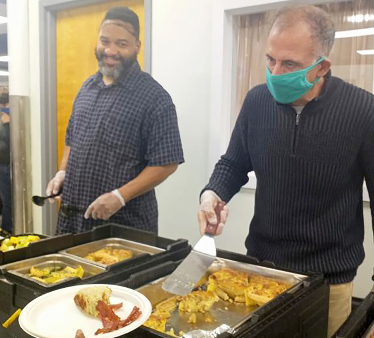 Kevin Frank serves food