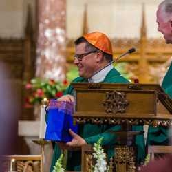 Bishop-elect Lucia sports his custom orange zuchetto.(Photos courtesy the North Country Catholic)