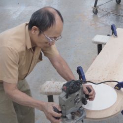 Stickley Cabinet Marker Dung Tran machines Bishop-elect Douglas J. Lucia coat of arms. (Sun photo | Chuck Wainwright)