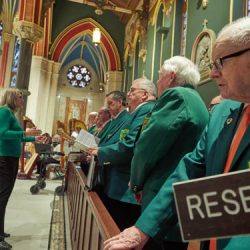 The Dr. Tom Dooley Choraliers participate in the Mass at the Cathedral of the Immaculate Conception in Syracuse. (Sun photo | Chuck Wainwright)
